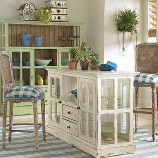 Mid-sized mediterranean kitchen pantry remodeling - Kitchen pantry - mid-sized mediterranean kitchen pantry idea in Manchester with glass-front cabinets, light wood cabinets, wood countertops, white backsplash and an island