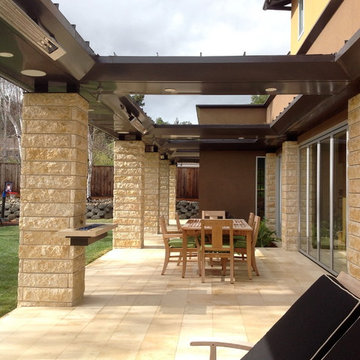 stone terrace with garden and accordion doors