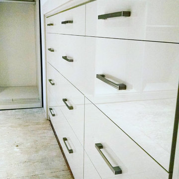 Contemporary Master Closet in high-gloss white and linen finish