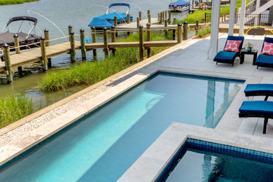 Inspiration for a small coastal backyard tile and custom-shaped lap hot tub remodel in Other