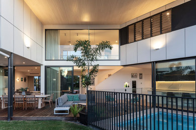 Example of a trendy home design design in Sunshine Coast