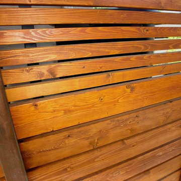 Detail of wood and steel privacy fence