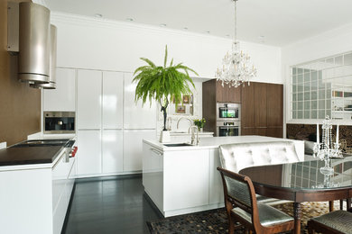 Example of a large trendy u-shaped dark wood floor eat-in kitchen design in Baltimore with flat-panel cabinets, white cabinets, stainless steel appliances, an island, an undermount sink and quartz countertops