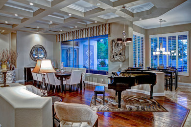 Example of a mid-sized trendy medium tone wood floor kitchen/dining room combo design in Las Vegas with beige walls