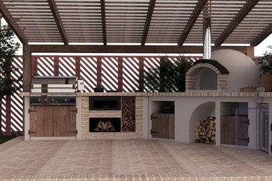 Inspiration for a mid-sized mediterranean backyard brick patio kitchen remodel in Seattle with a pergola