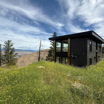 Exteriorview of rustic modern cabin with valley views