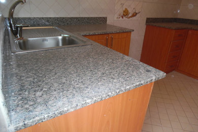 Example of a minimalist kitchen design in Other