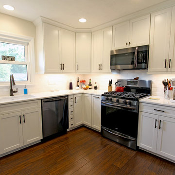 Waypoint Painted Linen Cabinets with Zodiaq Blue Carrara Quartz Countertop