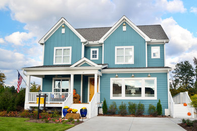 Inspiration for a transitional blue three-story mixed siding exterior home remodel in Raleigh