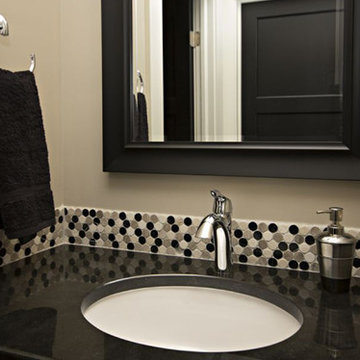 Dark countertop with circle accent tiles