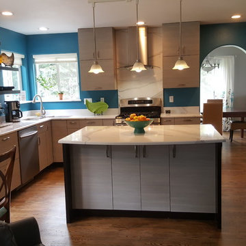 This is a two tone updated kitchen with efficient use of space & feature points