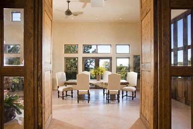 Inspiration for a large rustic concrete floor kitchen/dining room combo remodel in Albuquerque with beige walls and no fireplace