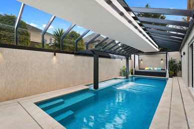 Inspiration for a mid-sized asian indoor rectangular lap pool in Melbourne with a pool house and tile.
