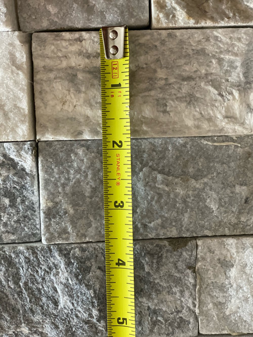 Hanging picture on stacked stone?