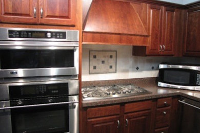 Inspiration for a kitchen remodel in Other with medium tone wood cabinets and granite countertops