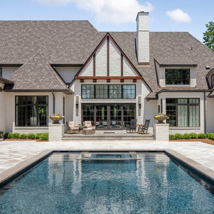 シャーロットの大きい長方形カントリー風おしゃれなプール (タイル敷き) の写真