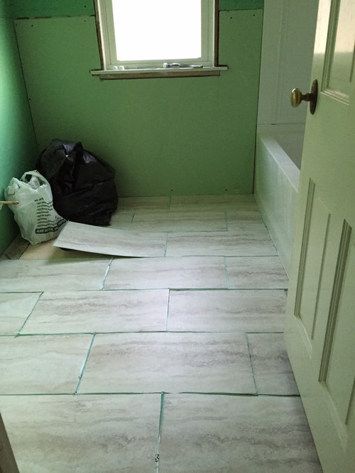 Which direction should I lay the 12x24 vinyl tiles in our