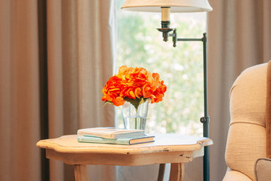 Mid-sized elegant built-in desk medium tone wood floor craft room photo in Phoenix with blue walls