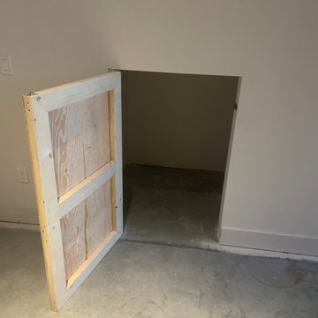 Custom shelving and hidden door