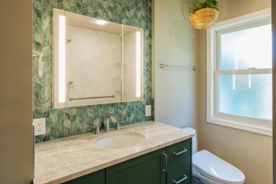 Walk-in shower - mid-sized modern master beige tile and porcelain tile single-sink walk-in shower idea in Portland with green cabinets, a one-piece toilet, an undermount sink, quartzite countertops, beige countertops and a built-in vanity