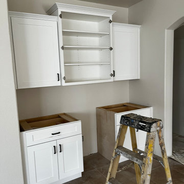 White Shaker Cabinets with Pony Wall and Vanity