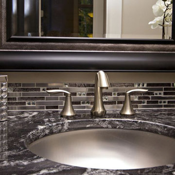 Dark marble countertop and stainless steel faucet