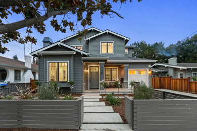 Inspiration for a craftsman green two-story wood and clapboard exterior home remodel in San Francisco with a shingle roof and a gray roof