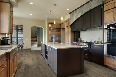 Inspiration for a large contemporary galley medium tone wood floor eat-in kitchen remodel in Chicago with an island