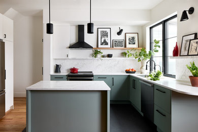 Enclosed kitchen - mid-sized modern u-shaped medium tone wood floor and brown floor enclosed kitchen idea in DC Metro with an undermount sink, flat-panel cabinets, green cabinets, marble countertops, white backsplash, marble backsplash, stainless steel appliances, an island and white countertops