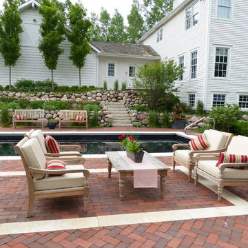 Poolside seating arrangement with brick area rug