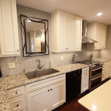 Medallion Painted White Chocolate Kitchen Cabinets with Petal Mosaic Backsplash