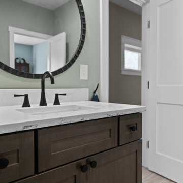 Warm and Cohesive Multi-Bathroom Design In Nokesville