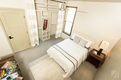 Inspiration for an industrial guest concrete floor bedroom remodel in Austin
