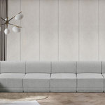 Meridian Furniture - Ollie Black Boucle Fabric L-Shaped Modular Sectional, Grey, 8-Piece: 6 Armless Chair, 2 Corner Chair - The Ollie Boucle Fabric Sectional is a truly stunning piece that boasts an elegant and attention-grabbing design. It is upholstered in a rich grey boucle fabric that feels soft and smooth to the touch, making it the perfect addition to any space that requires a touch of sophistication and style. The sectional's modular design ensures that it can easily fit into any room layout, while its plush cushioning provides optimum comfort for you and your guests. Whether you're entertaining guests or simply relaxing after a long day, the Ollie sectional is the perfect piece to help you unwind in style.