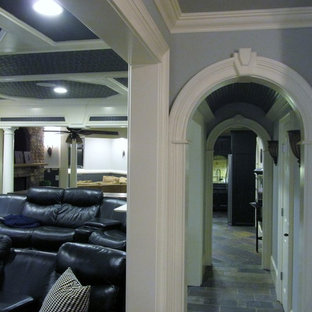 Inspiration for a large classic enclosed home cinema in Atlanta with grey walls, slate flooring, grey floors and a wall mounted tv.