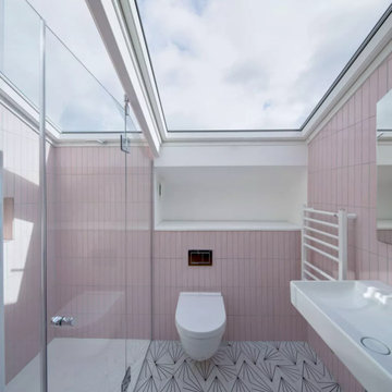 Ensuite loft bathroom styled pink and graphic tiles
