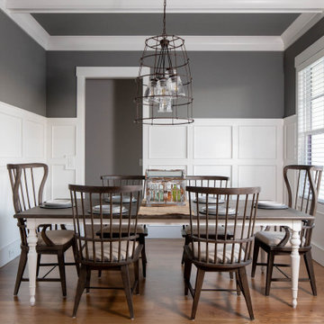 Dining Room with Board-and-Batten Wainscot and Lantern Pendants