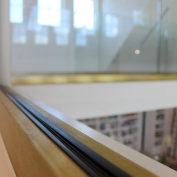 Glass Balustrade with Aluminum Base Rail Finished with Satin Brass Cladding