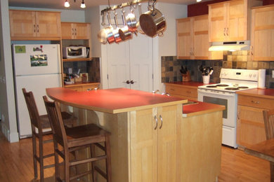 Inspiration for a mid-sized craftsman l-shaped dark wood floor and tray ceiling eat-in kitchen remodel in Calgary with an undermount sink, shaker cabinets, white cabinets, quartzite countertops, red backsplash, brick backsplash, stainless steel appliances, a peninsula and white countertops
