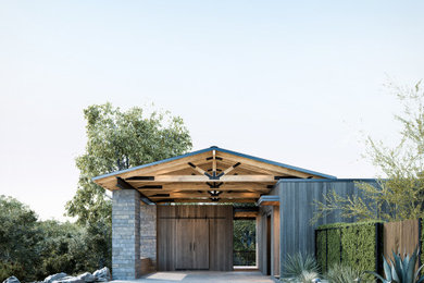 Mid-sized transitional home design photo in Austin