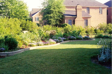 This is an example of a large traditional full sun backyard landscaping in Other.