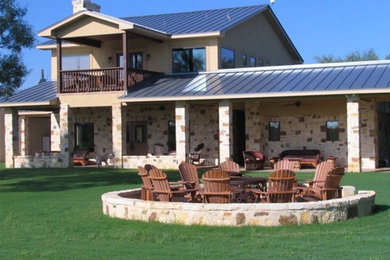 Large rustic beige two-story mixed siding gable roof idea in Austin