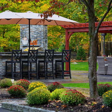 Make a Statement with a Versatile Outdoor Kitchen and Double Fire Feature