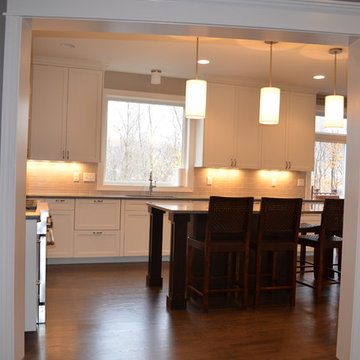 Kitchen With Large Center Island and Separate Cooking Area