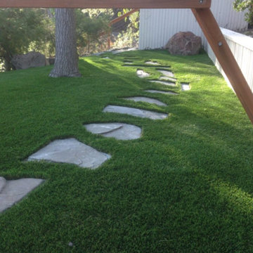 Artificial turf installation between pavers