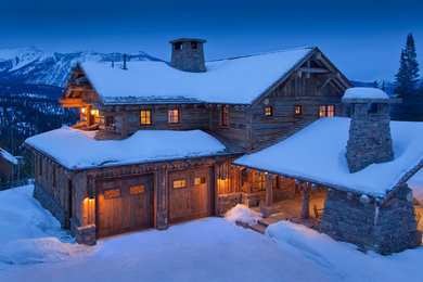 Mountain style wood exterior home photo in Other