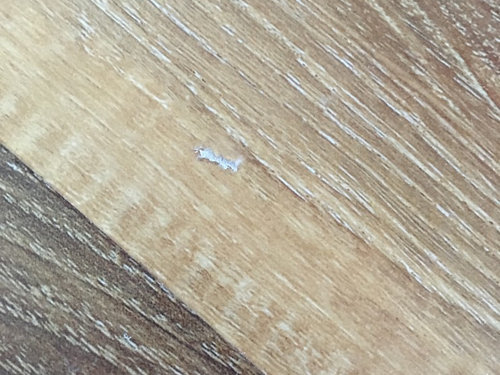 How Can I Repair Two Small Gouge Tears In Vinyl Plank Floor