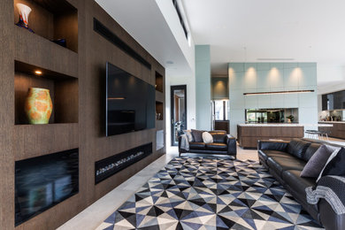 Inspiration for an expansive modern formal open concept living room in Sydney with white walls, porcelain floors, a standard fireplace, a wood fireplace surround, a built-in media wall and grey floor.