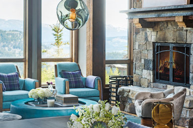 Living room - large rustic open concept medium tone wood floor living room idea in San Francisco with a standard fireplace, a stone fireplace and gray walls