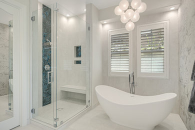 Example of a large trendy master white tile and ceramic tile ceramic tile, white floor and double-sink bathroom design in San Diego with flat-panel cabinets, blue cabinets, a two-piece toilet, an undermount sink, quartz countertops, a hinged shower door, white countertops and a built-in vanity